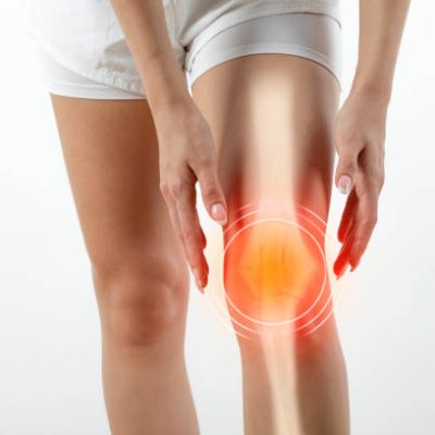Woman suffering from pain in knee