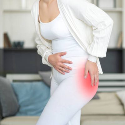 Hip pain, woman suffering from osteoarthritis at home, health problems concept