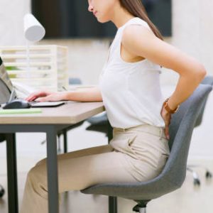 pain at work - asian business woman suffer from spine and waist ache in office